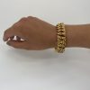 Mesure et art du temps - Bracelet, Armlet, en Or Jaune 18 Carats avec Chainette Armlet avec un fermoir et une chainette pour sécuriser le bracelet à votre poignet. Largeur : 1,6 cm Longueur : 20 cm