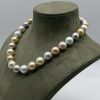 Tahitian Pearl Necklace 18K Yellow Gold Necklace of 29 Tahitian Pearls with a 18k Yellow Gold buy clasp. Size 14/15 mm Silky and bright dresses. Triple A classification. Natural pastel color.